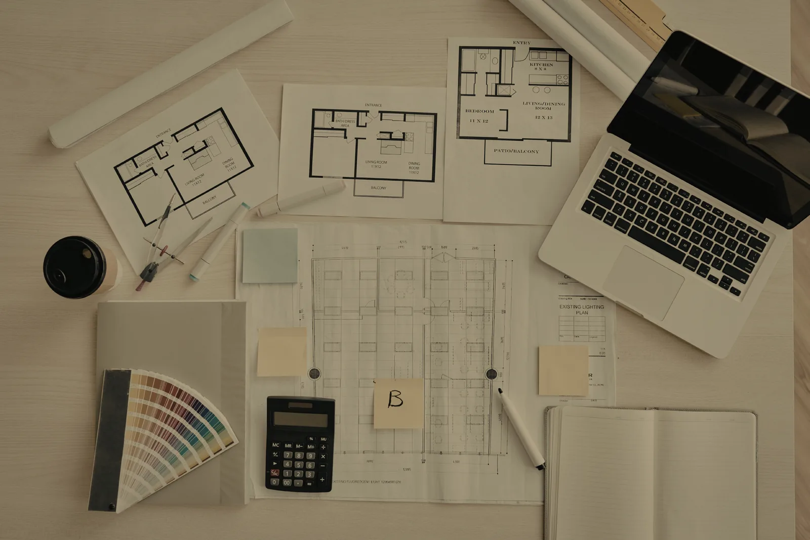 Interior design materials, finishes, and drawings laid out for review